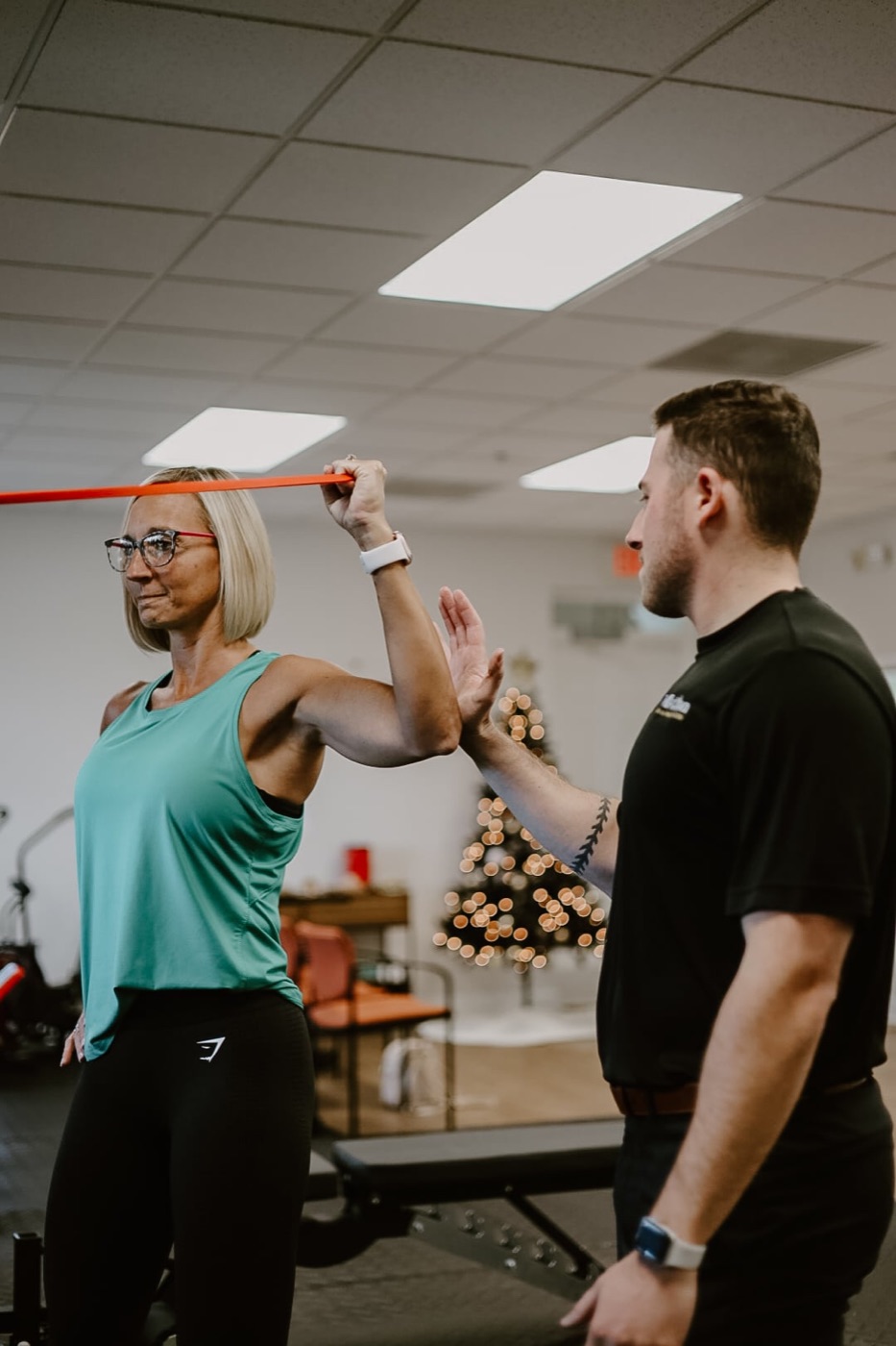 Coached resistance band shoulder work at In Motion in Oviedo, FL